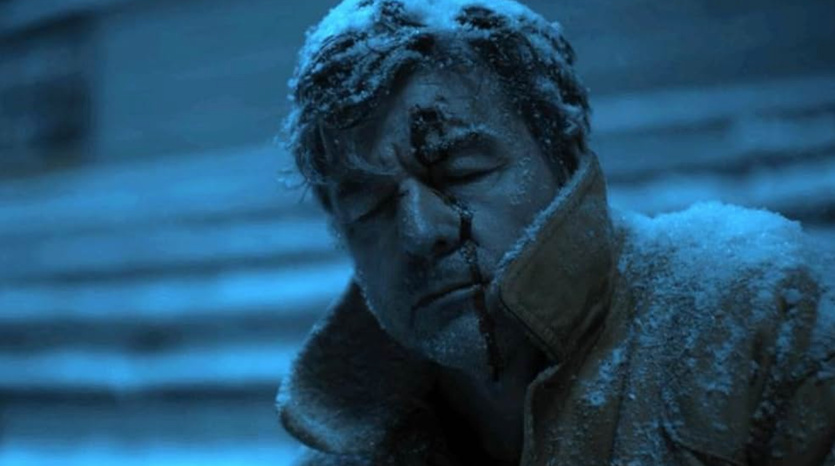 a dead frozen man on a snowy bleacher