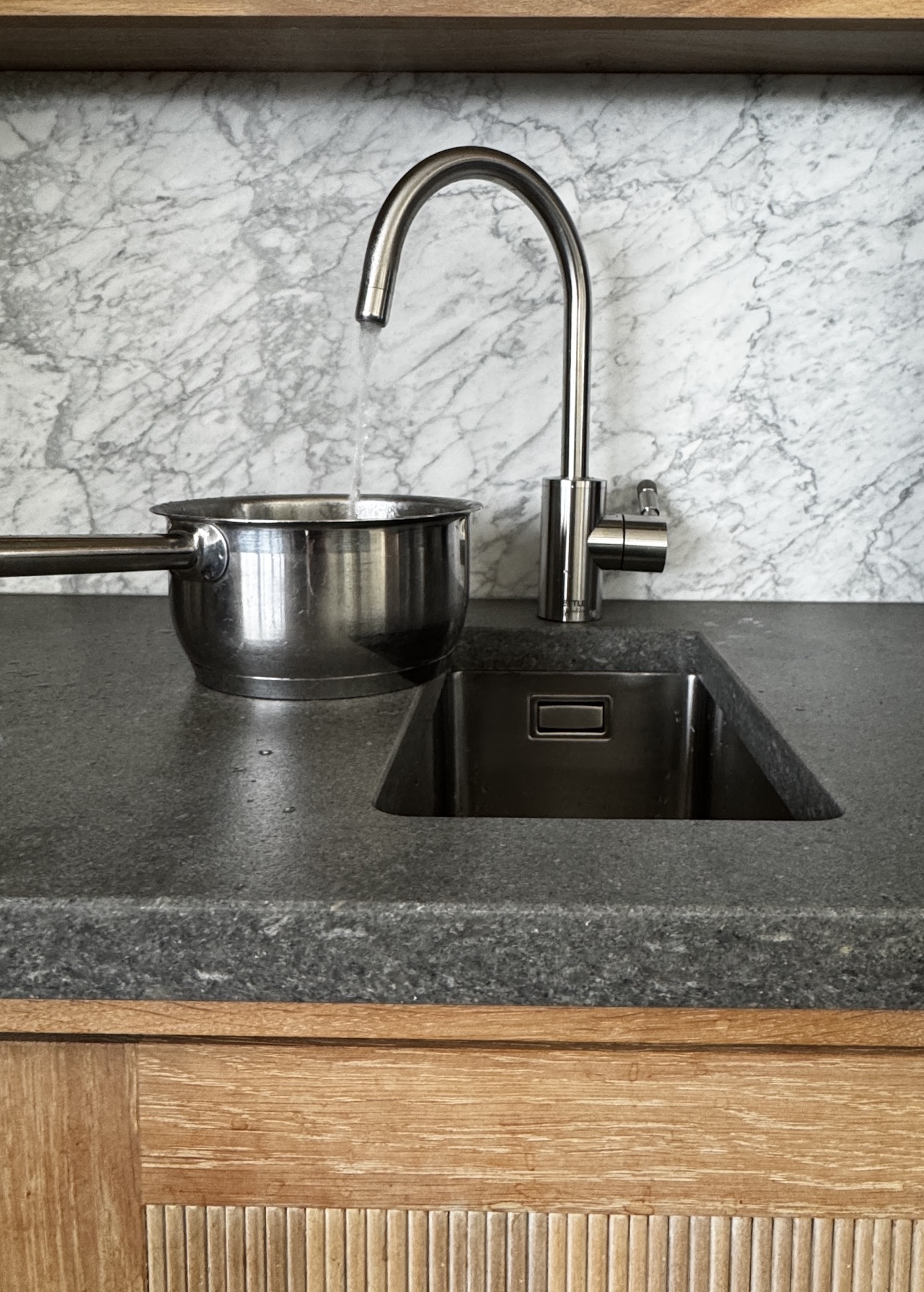 close up of boiling water tap filling a pan