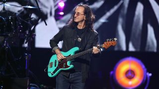 Geddy Lee on stage with his bass guitar