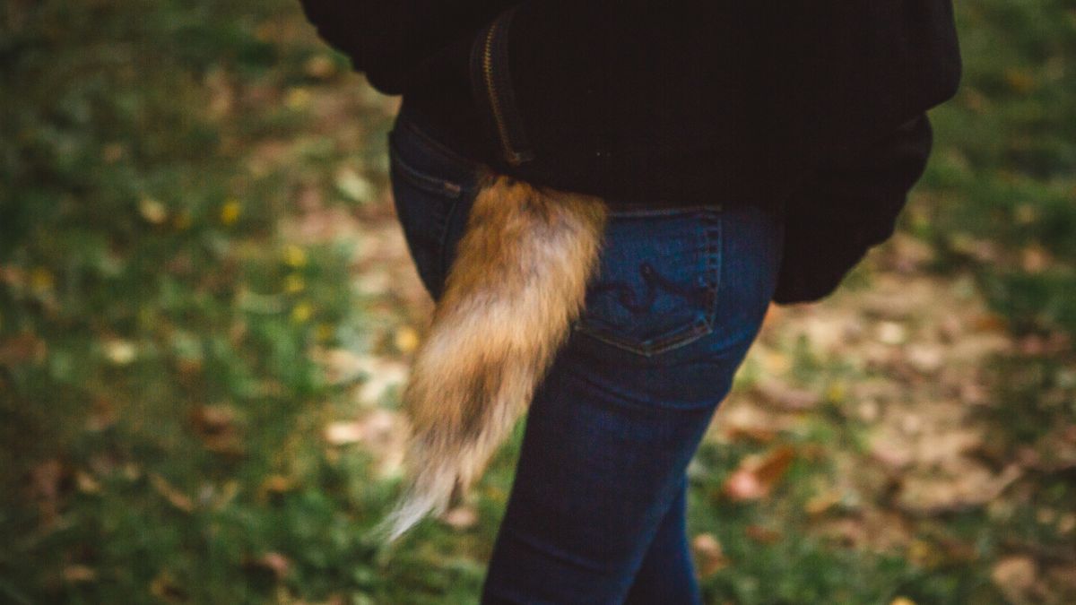 Woman wearing a fox tail costume