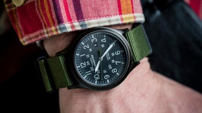 Close up of a man's wrist with a black Timex Expedition on, one of the best watches under £200
