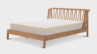 The Eve Premium Hybrid Mattress shown on a wooden bed frame