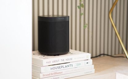 a sonos speaker on books