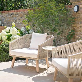 Cream coloured garden furniture with cream coloured outdoor cushion decor