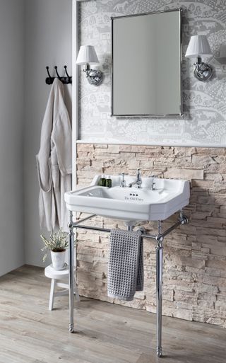 neutral, textured tiles in a small bathroom