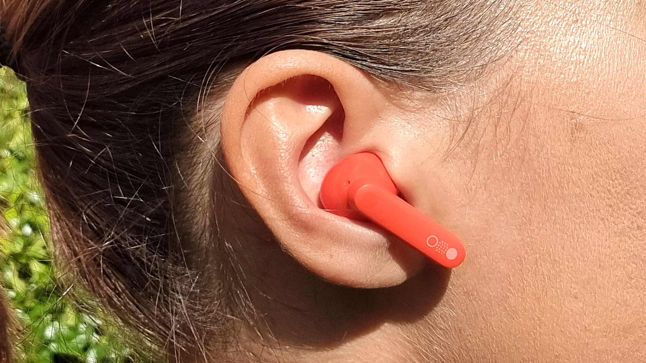 a close-up picture of our reviewer wearing the CMF by Nothing Buds Pro 2