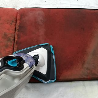 Vax Steam Fresh Combi S86-SF-C Steam Mop being used on a red cushion