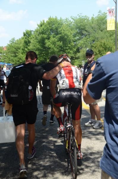 Matthew Busche (RadioShack) is escorted to the podium.