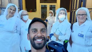 Bobby Seagull poses with volunteers in Fatima in Pilgrimage.