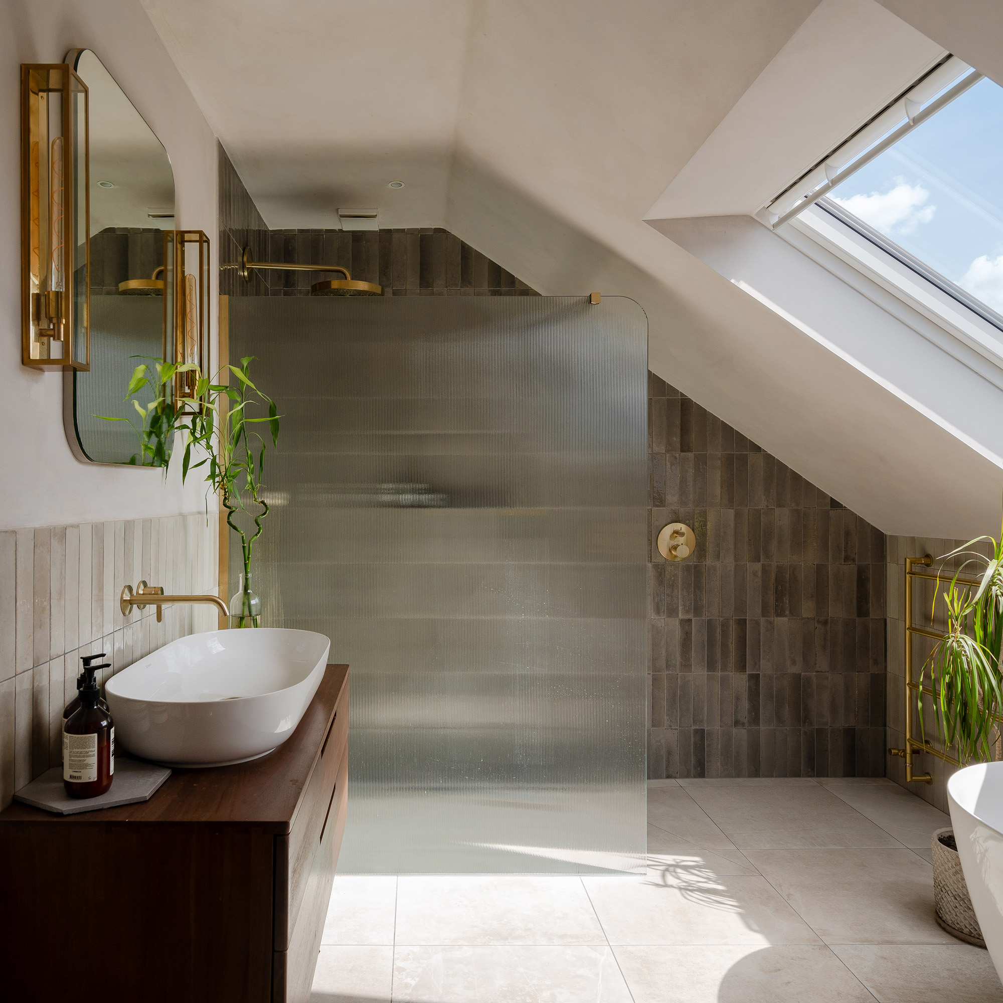 spacious wet room with shower and wooden vanity and sink