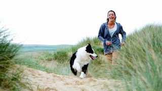 Woman at the beach with dog