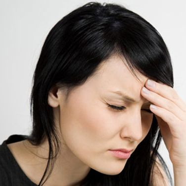 stressed woman with a headache