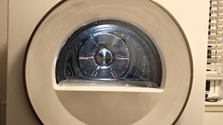 Clear internal view of drum of ASKO Tumble Dryer T411VDW with door shut