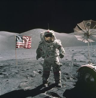 In this photo, taken during the second spacewalk on December 12, 1972, Cernan is standing near the lunar rover.