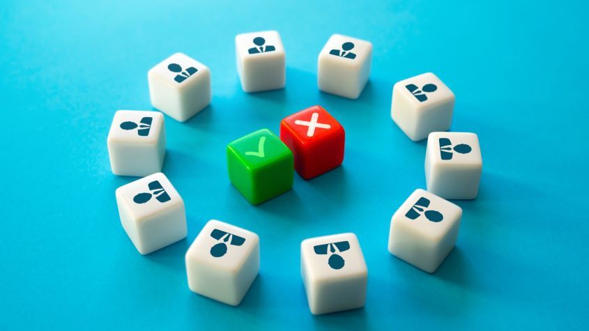 White cubes with business person icons on, arranged in a circle