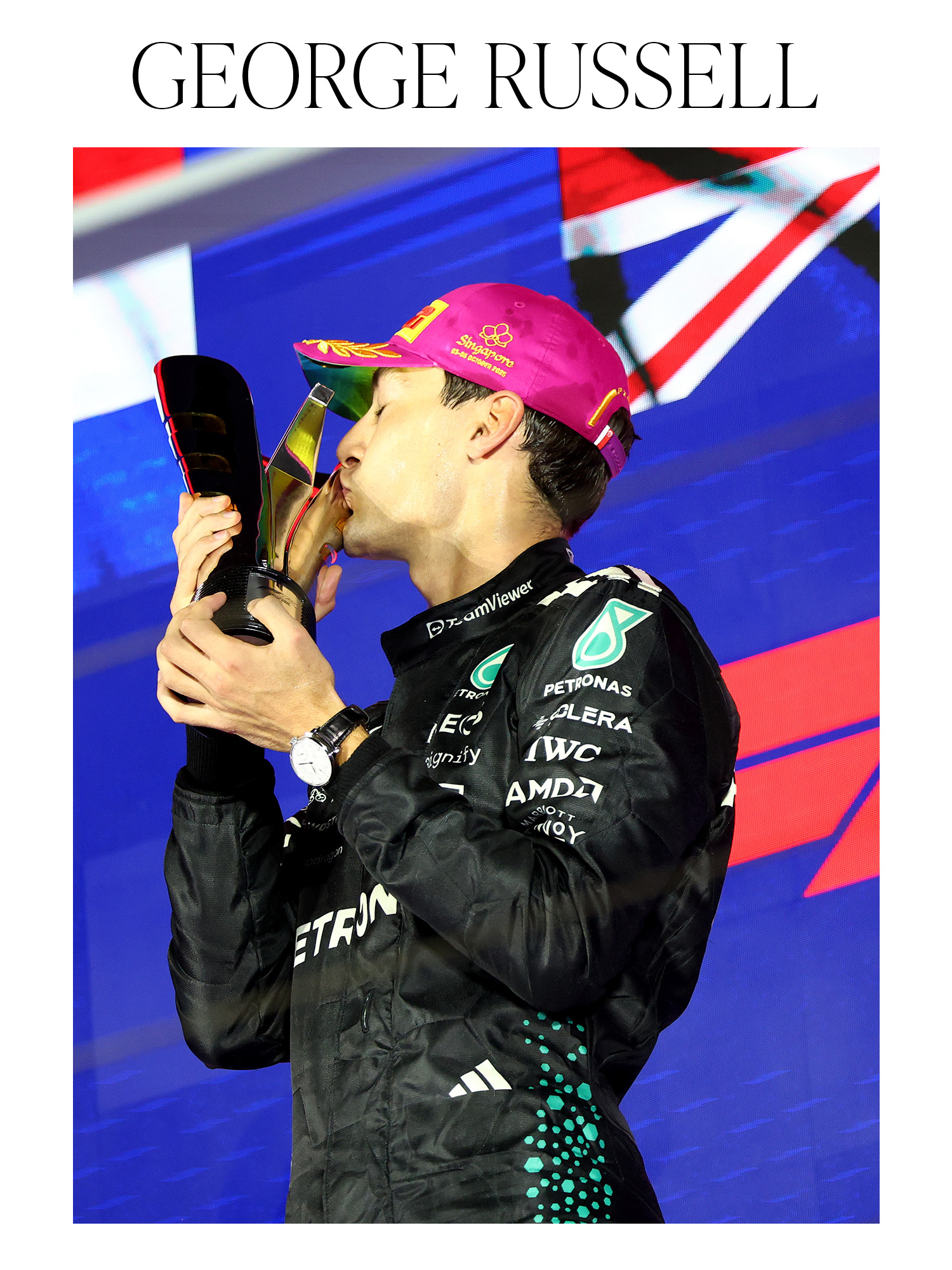 SINGAPORE, SINGAPORE - OCTOBER 05: Race winner George Russell of Great Britain and Mercedes AMG Petronas F1 Team kisses his trophy on the podium during the F1 Grand Prix of Singapore at Marina Bay Street Circuit on October 05, 2025 in Singapore, Singapore.