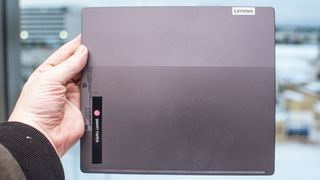 Lenovo Smart Paper e ink writable tablet with book on screen