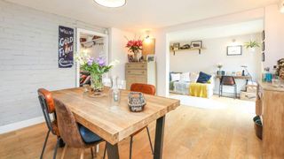 open plan kitchen and snug with engineered wooden flooring