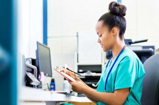 photo of medical staff checking computer