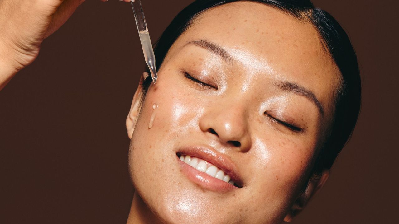 woman using one of the best face serums - getty images 1522079594