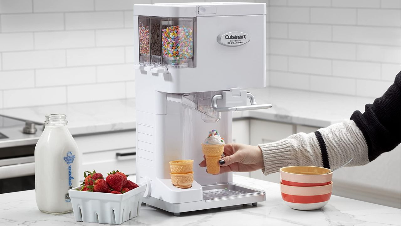 Cuisinart Soft Serve Ice Cream Maker on marble worktop with pint of whole milk and punnet of fresh strawberries