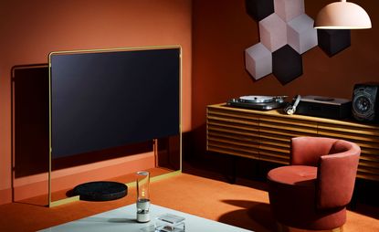Pictured, Bild X concept TV, price on request, by Bodo Sperlein, for Loewe. ‘USM Haller’ table, price on request, by USM. LSPX-S1 speaker, £799, by Sony. Crystal box, £595, by Asprey.