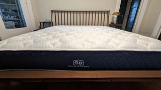 The Brooklyn Bedding Signature Hybrid with Cloud Pillow Top mattress on a bed