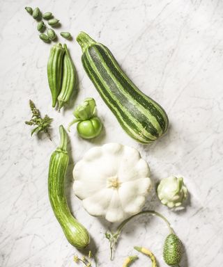 A flatlay showing a variety of unusual green and white vegetables