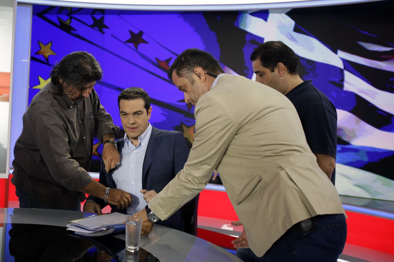 Greece&amp;#039;s prime minister prepares for a TV interview.