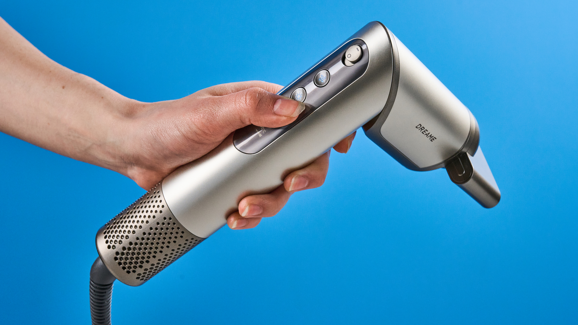 Dreame Dazzle air styler photographed in front of a blue background