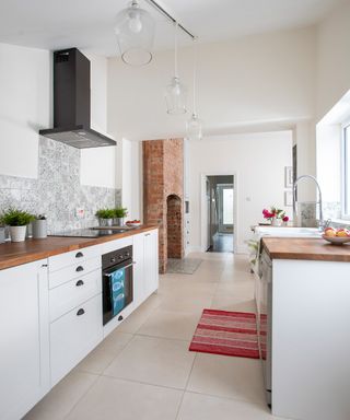 small white kitchen with wooden worktops