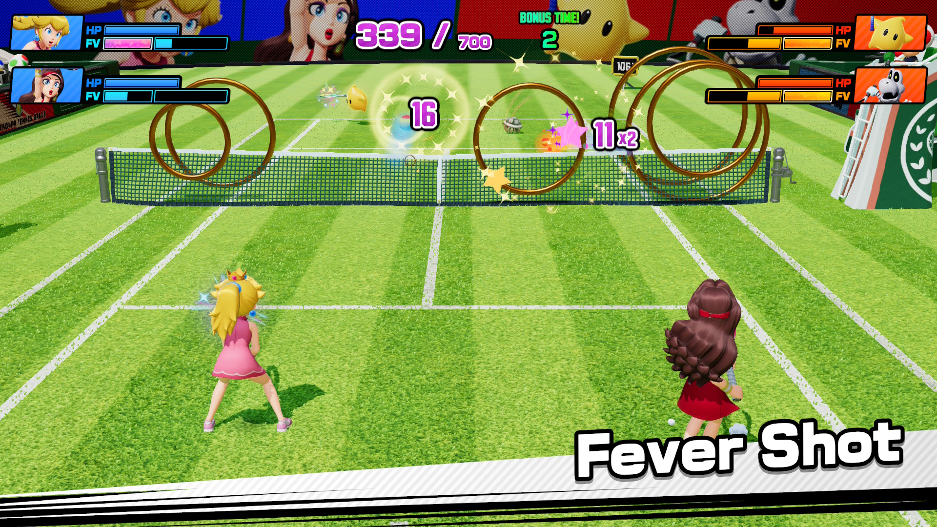 Peach and Paulina activate a Fever Shot in Mario Tennis Fever on a green court