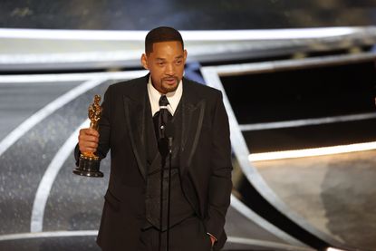 close up of actor Will Smith with his Oscars award