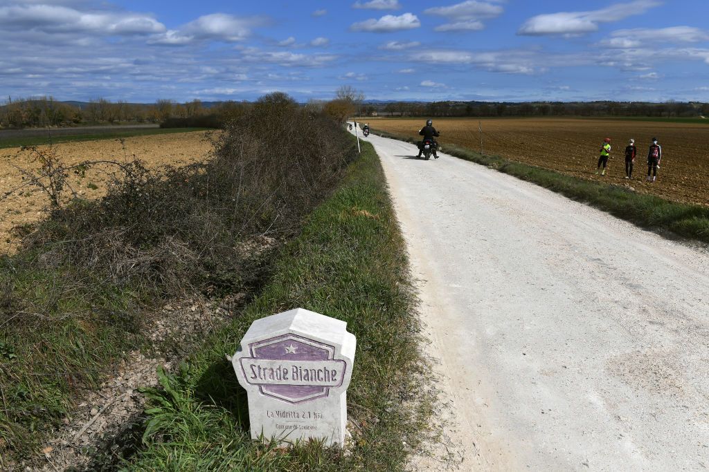 SIENA ITALY MARCH 06 Strade Bianche Boundary marker stone during the Eroica 15th Strade Bianche 2021 Mens Elite a 184km race from Siena to Siena Piazza del Campo Gravel Strokes Landscape Fans Public StradeBianche on March 06 2021 in Siena Italy Photo by Tim de WaeleGetty Images