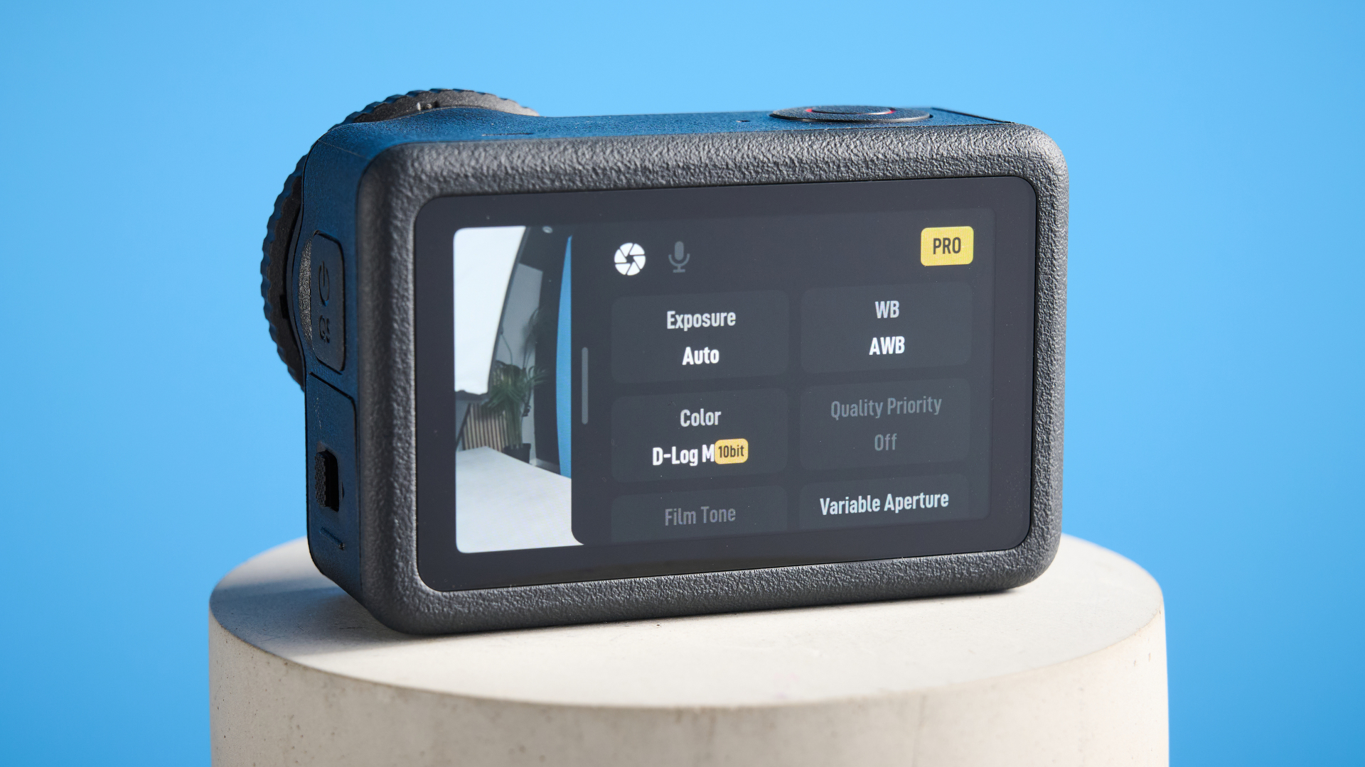 The DJI Osmo Action 6 on a stone surface with a blue background