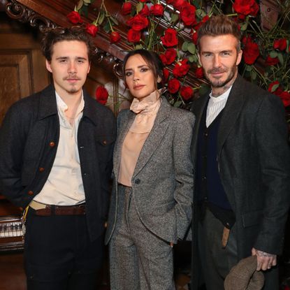 David, Victoria and Brooklyn Beckham attend the Kent & Curwen presentation at London Fashion Week in 2019