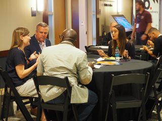 Attendees network at the Aug. 2019 AV/IT Summit in New York.