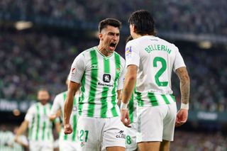 Marc Roca of Real Betis celebrates with teammate Hector Bellerin after scoring the team's second goal during the LaLiga EA Sports match between Real Betis and Valencia CF at Estadio Benito Villamarin on October 01, 2023 in Seville, Spain.