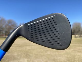 The Lag Shot training aid has a regular clubhead on it so you can hit balls with it.