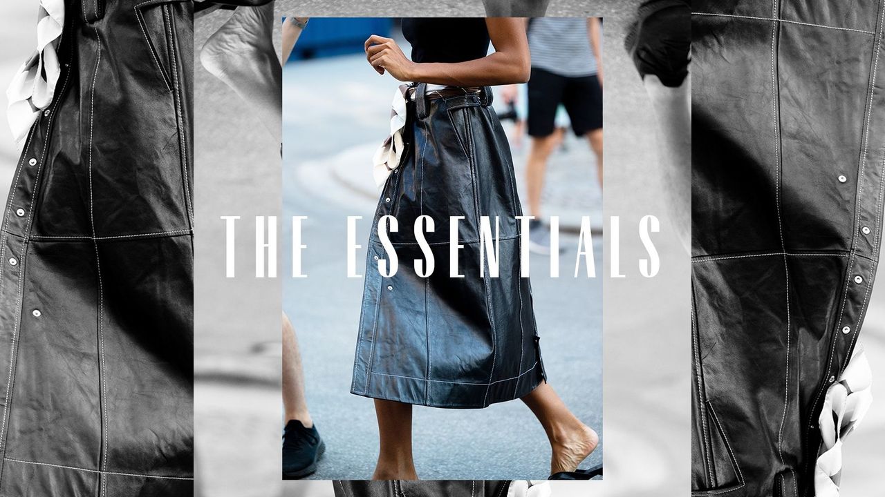 A woman walking down the street in a leather skirt. Overlaid text reads ,&quot;The Essentials&quot;