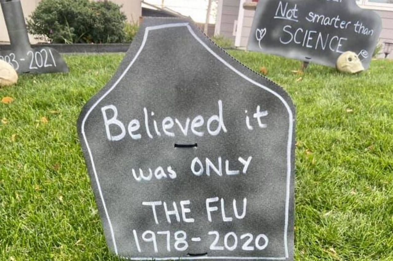 A headstone reading &amp;#039;Believed it was on the Flu&amp;#039;