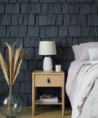 Bedroom with black textured wall