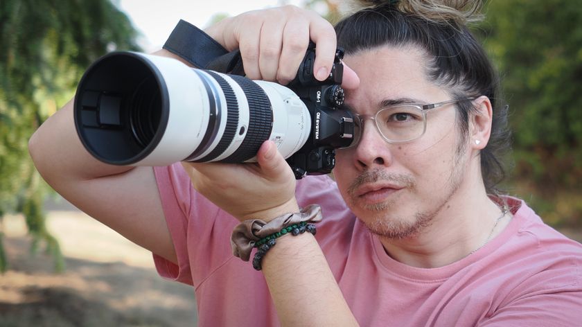 The OM System M.Zuiko 50-200mm f/2.8 IS Pro lens, mounted to the OM System OM-1 Mark II, being used by photographer James Artaius