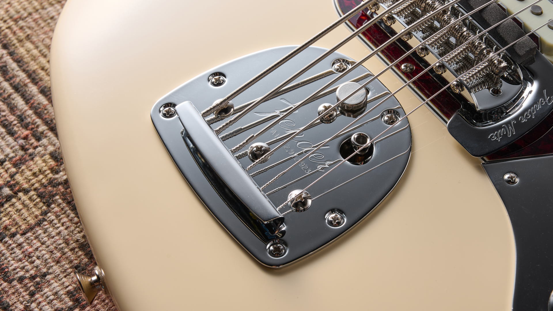 Fender Vintera III Early‌ '60s Bass VI​ in Olympic White with red tortoiseshell pickguard.