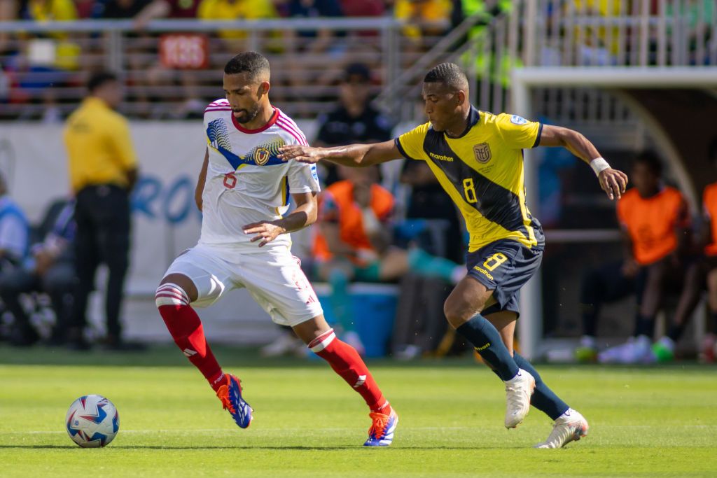 Yangel Herrera #6 of Venezuela dribbles away from Carlos Gruezo #8 of Ecuador during a Copa America 2024 Group B match between Venezuela and Ecuador at Levi&#039;s Stadium on June 22, 2024 in Santa Clara, California