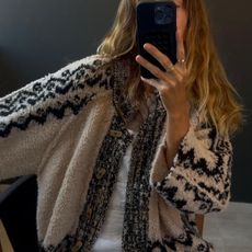 Angie wears a soft cardigan from Free People