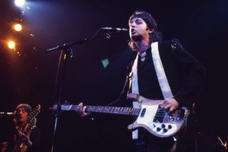 Paul McCartney (holding his Beatles-era Rickenbacker 4001S bass) performs with Wings in 1976. That's guitarist Denny Laine (formerly of the Moody Blues) in the lower left-hand corner.