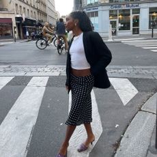 @rayan.xasan wears a black-and-white polka dot skirt