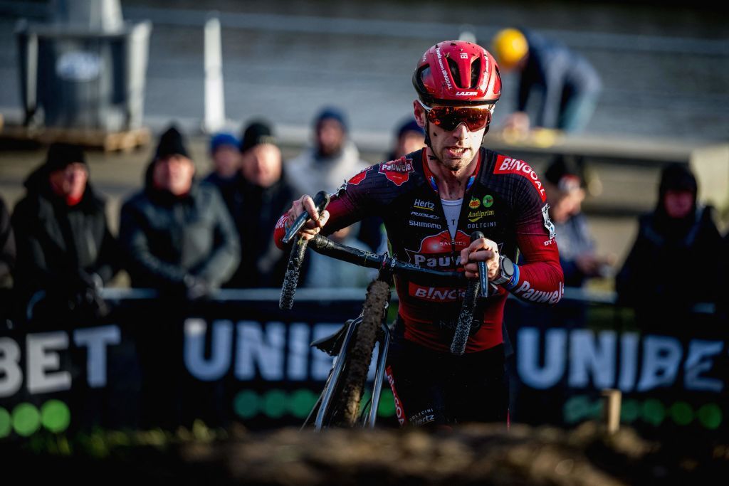 Belgian rider Eli Iserbyt wheels his bike as he competes in the mens elite race at the Urban Cross Kortrijk cyclocross cycling event the second stage in the X2O Badkamers Trofee Veldrijden competition in Kortrijk on November 25 2023 Photo by JASPER JACOBS Belga AFP Belgium OUT Photo by JASPER JACOBSBelgaAFP via Getty Images