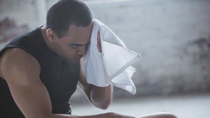 Wiping sweat after workout